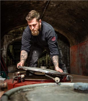 Winemaker closing a fermentation tank